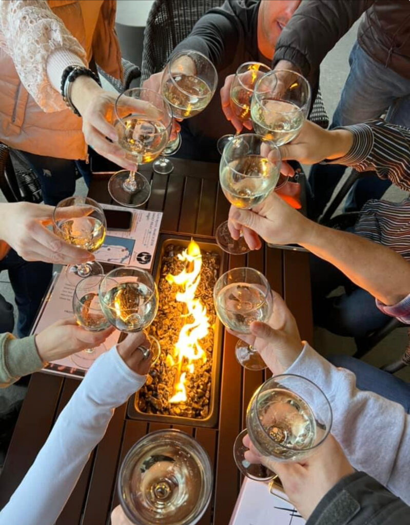 Frostbite Trail participants showing wine glasses in their hands.